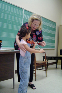 Playing the violin (5 years).